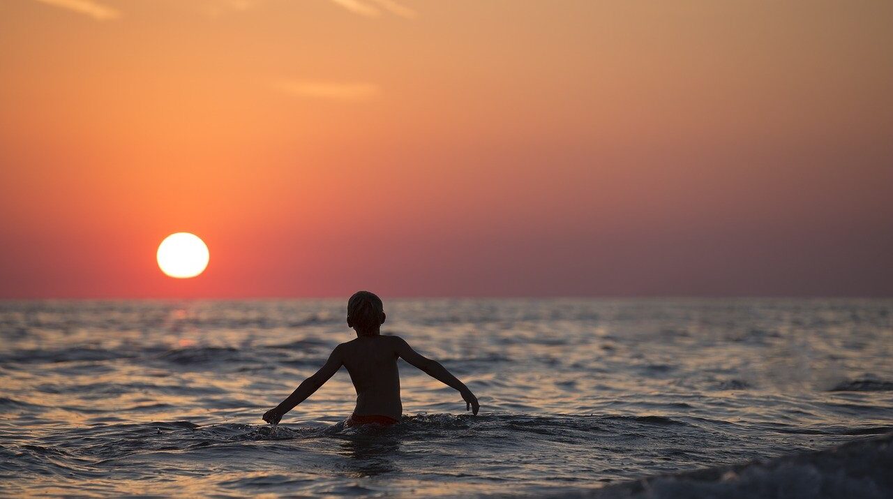 boy playing in the sea