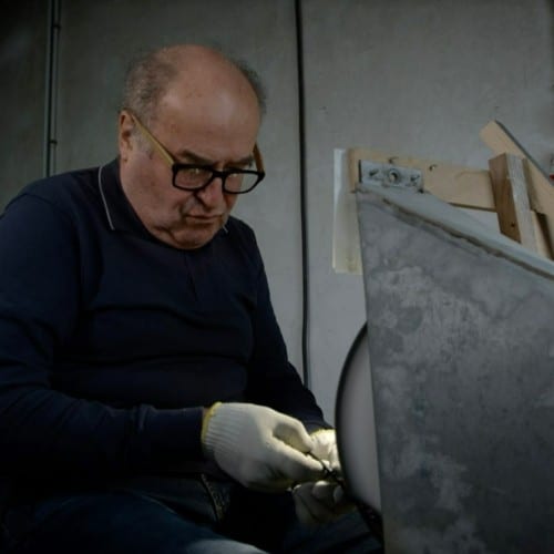 elderly man polishing sustainable Pala sunglasse