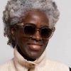 mzuri oyster main woman wearing pale oversize sunglasses