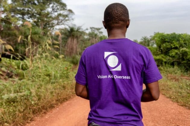 Man wearing vision aid overseas t-shirt