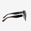 Amara BlackBlue - Archive Sale 3 Side angle of cateye oversized ethical sunglasses in black