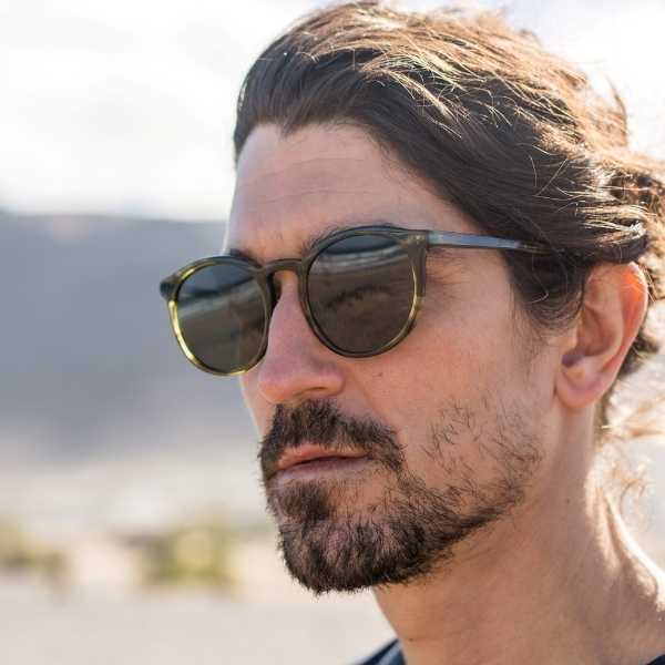 Darya Honey - Archive Sale 4 Man wearing round green ethical sunglasses