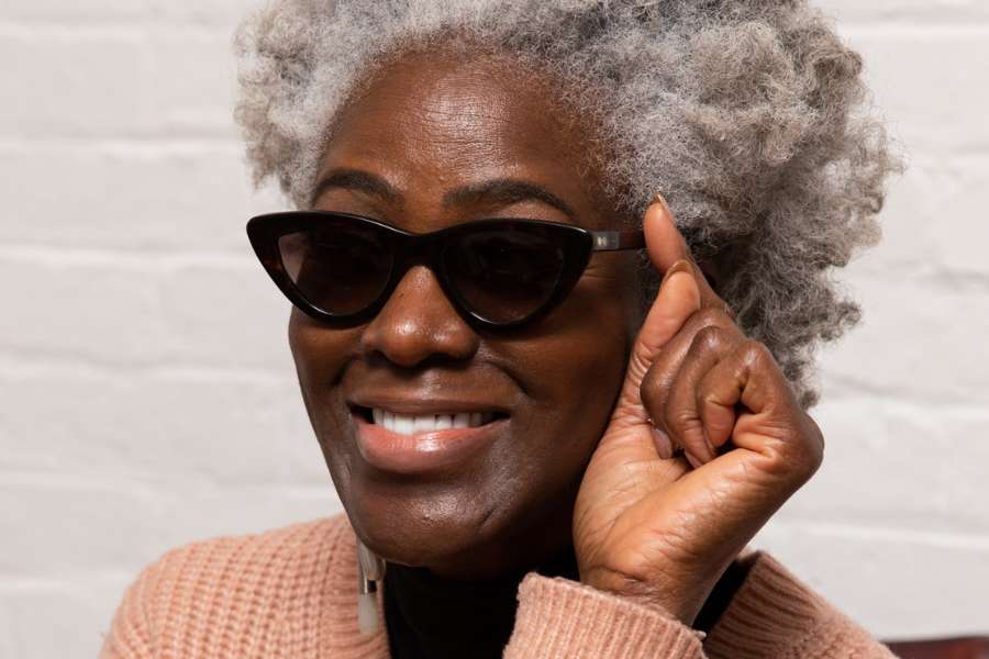 Woman wearing eco-friendly cat eye sunglasses. Supporting the Shop Ethical Instead Campaign