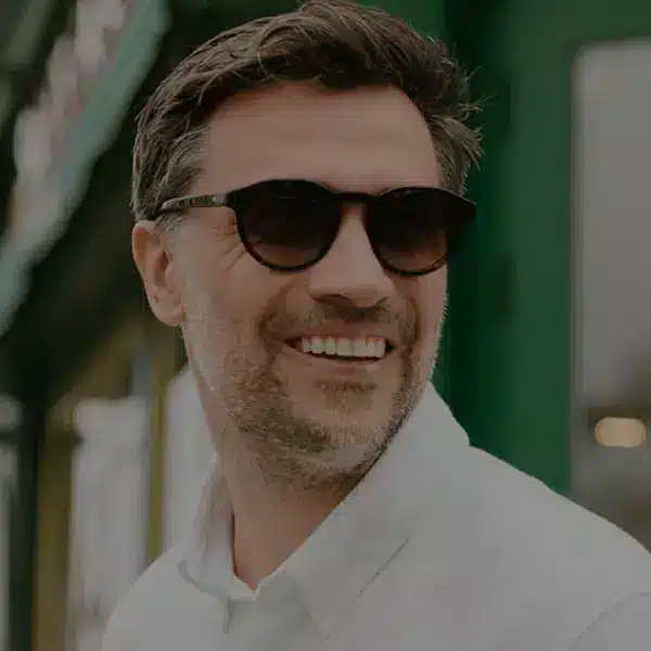 Stylish man wearing round sustainable sunglasses in tortoiseshell