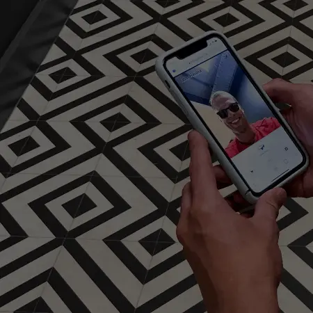 Man using mobile to try on sunglasses virtually before purchasing on the Pala website.