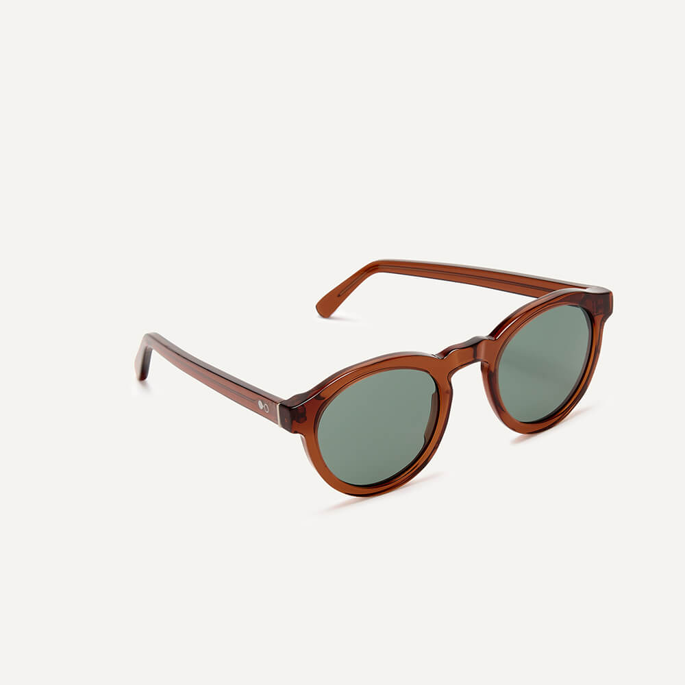 Lich Tawny Polarised Side - Grey JPEG Classic round sunglasses from in transparent tawny brown bio-acetate and grey-green polarised lenses for added clarity.
