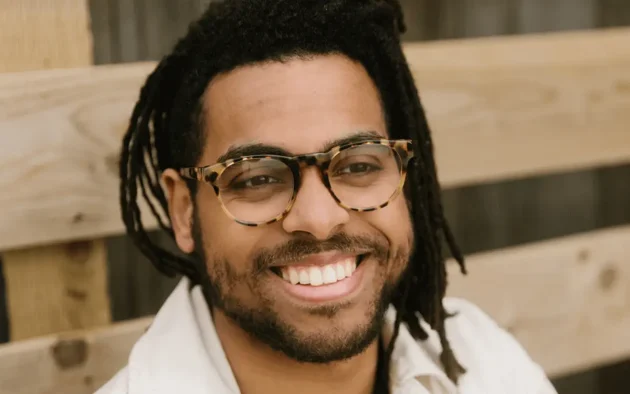 Man wearing pale brown tortoiseshell spectacles made from eco-friendly bio-acetate.